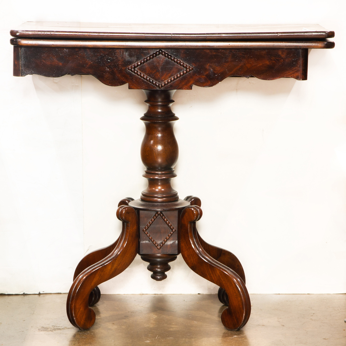 A ROSEWOOD FLIP TOP GAMES TABLE,