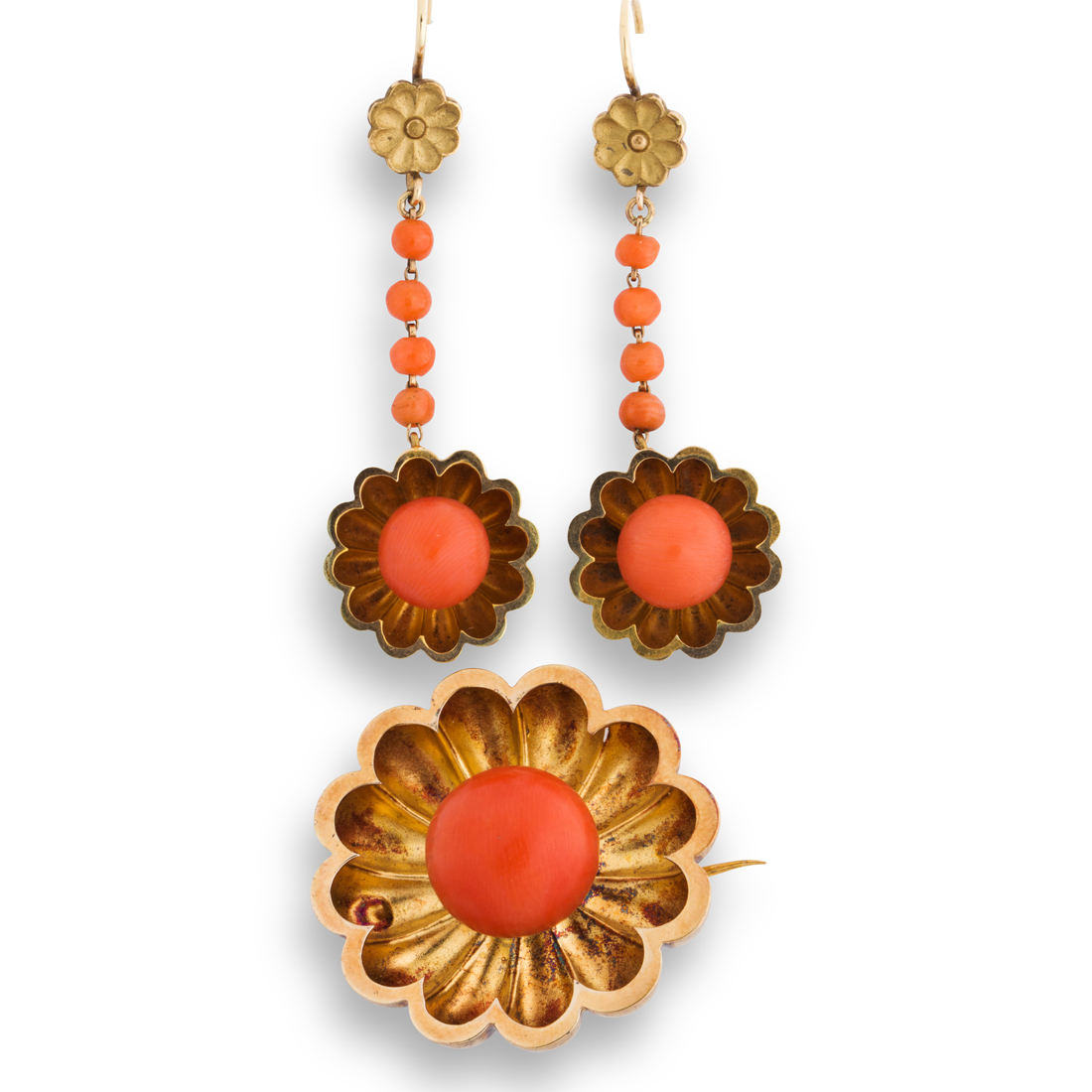 A CORAL AND FOURTEEN KARAT GOLD