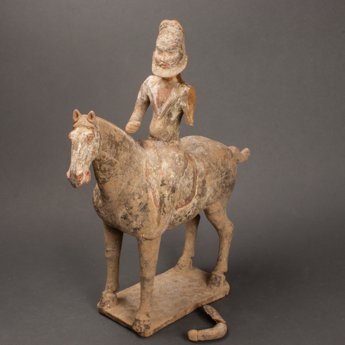 CHINESE PAINTED POTTERY HORSE WITH A