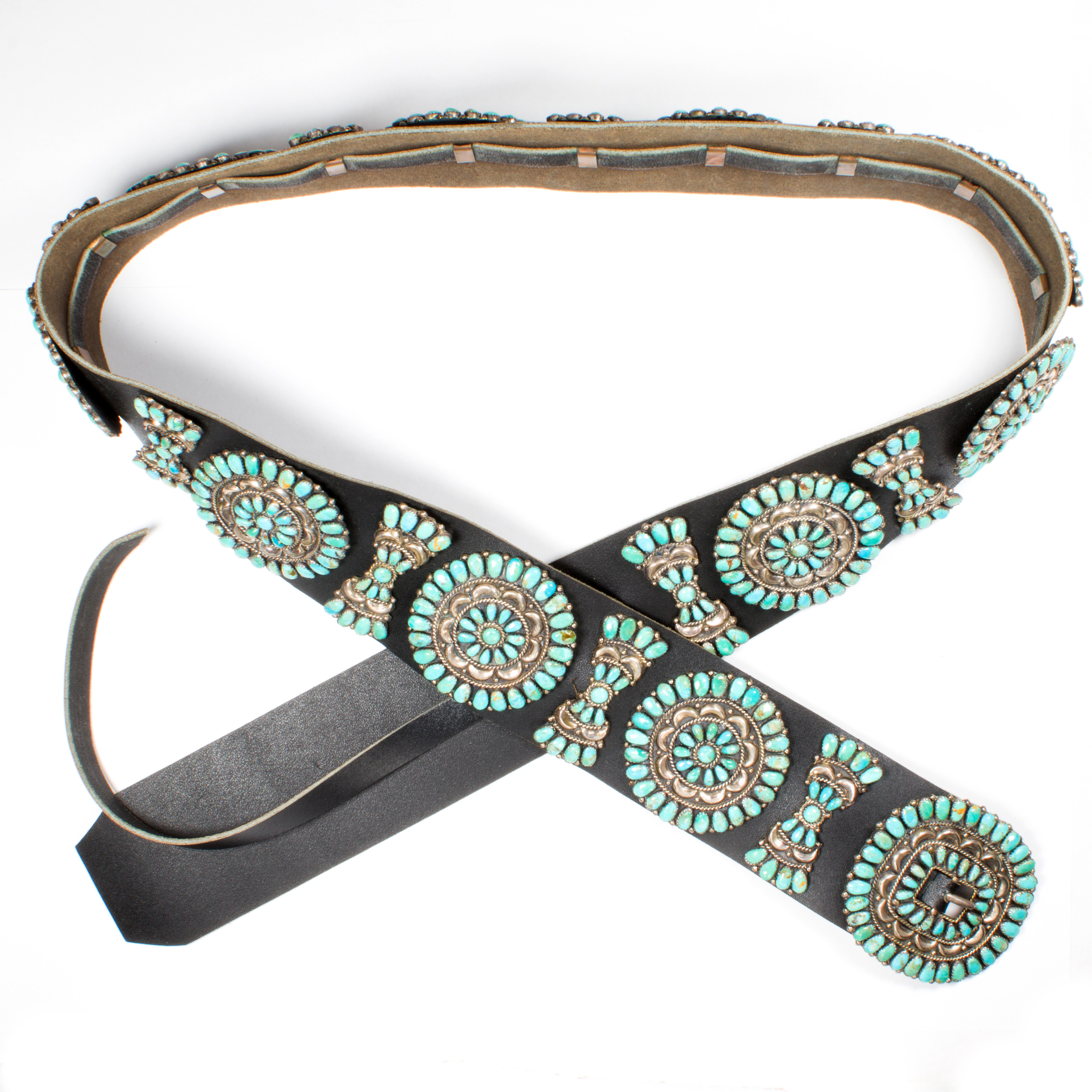 A TURQUOISE, SILVER AND LEATHER