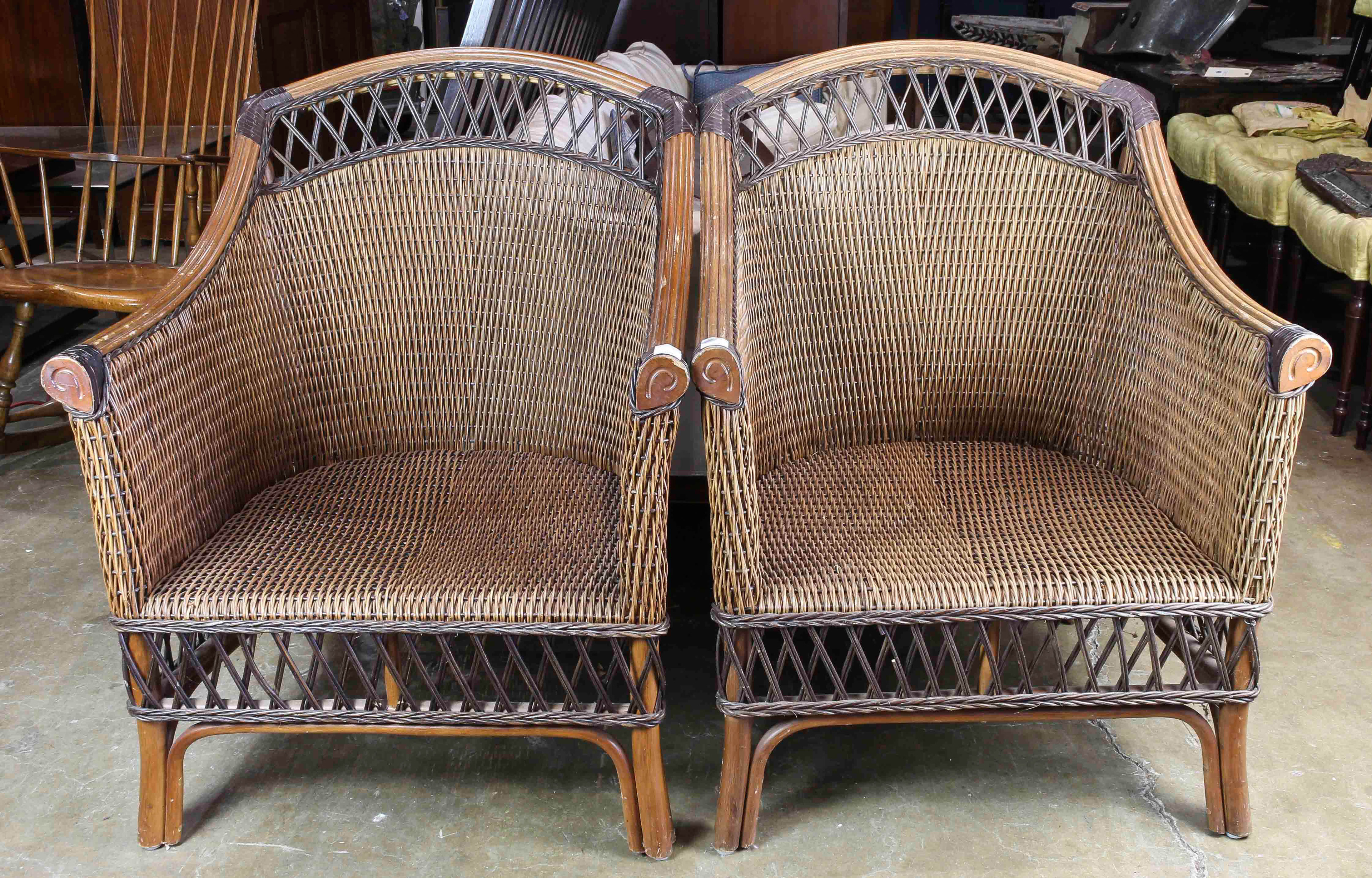 A PAIR OF WICKER ARM CHAIRS A pair of