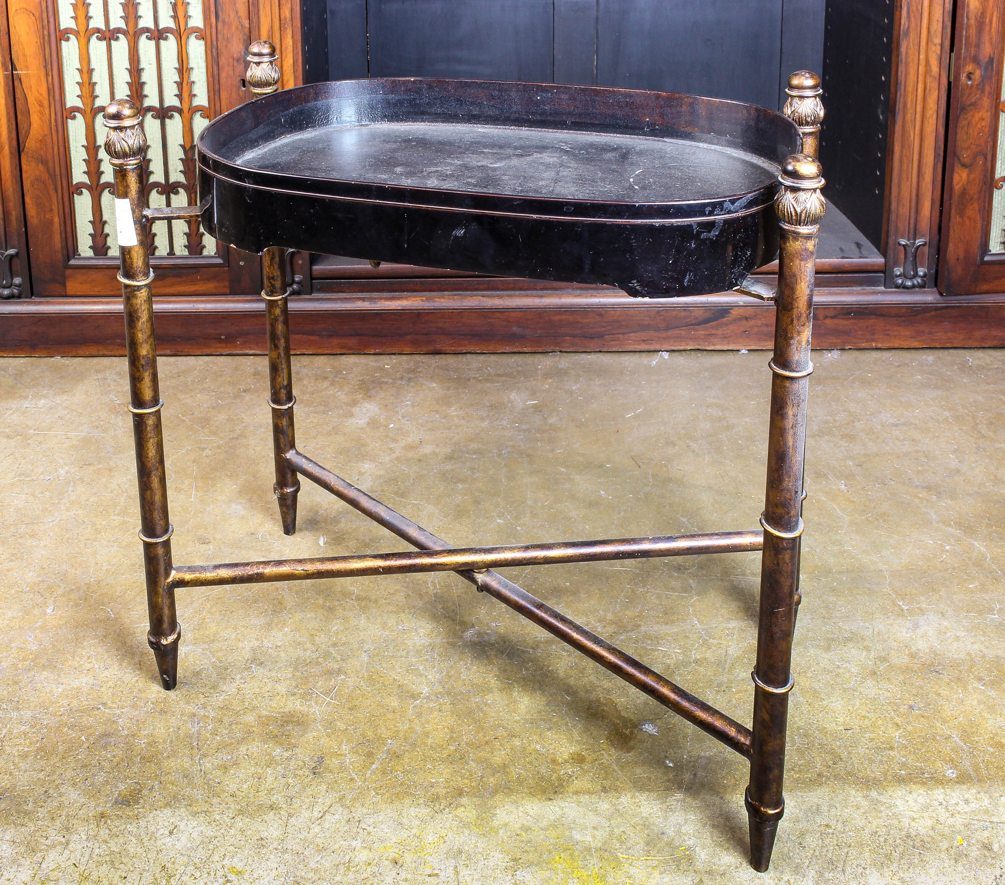 AN EBONIZED TRAY ON LATER STAND