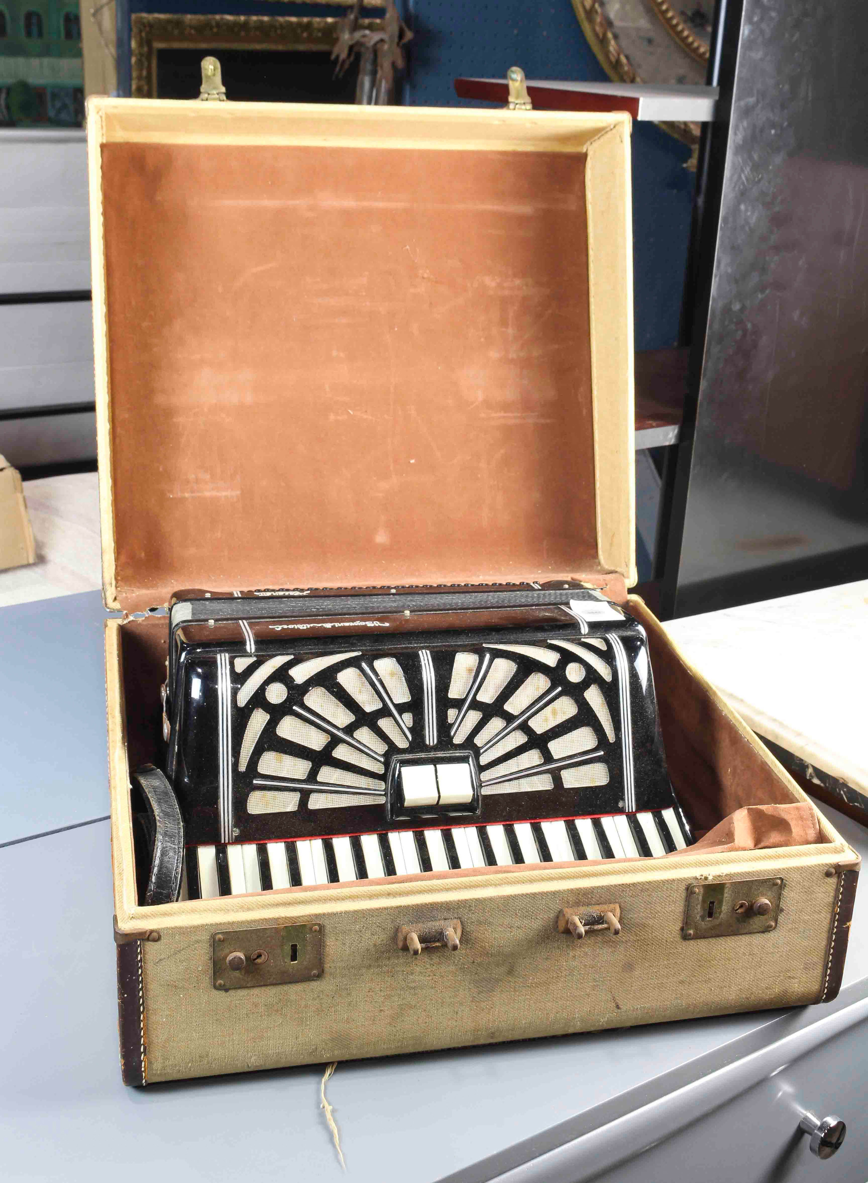 A CASED ART DECO ACCORDION A cased Art