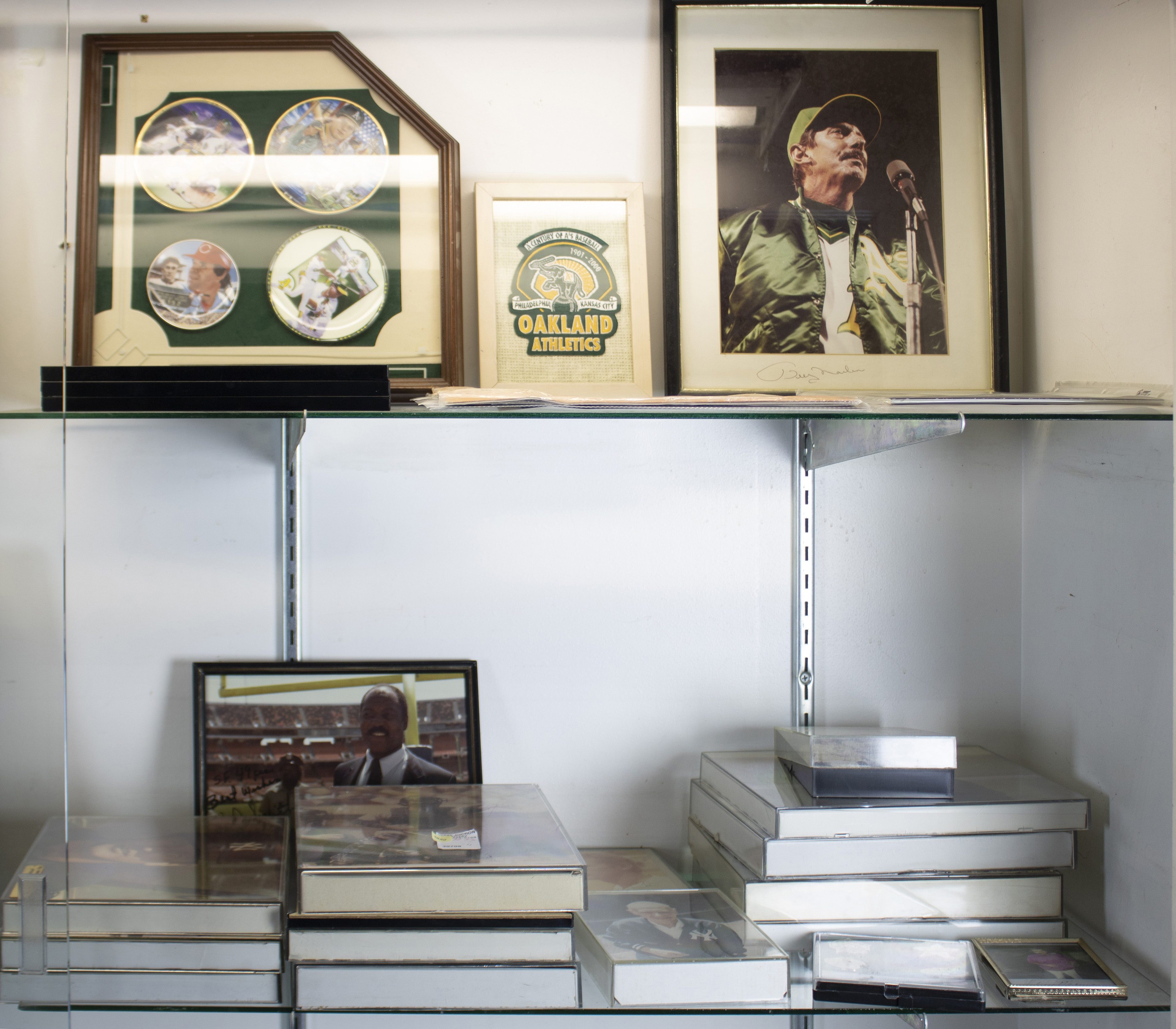 TWO SHELVES OF PHOTOGRAPHS INCLUDING