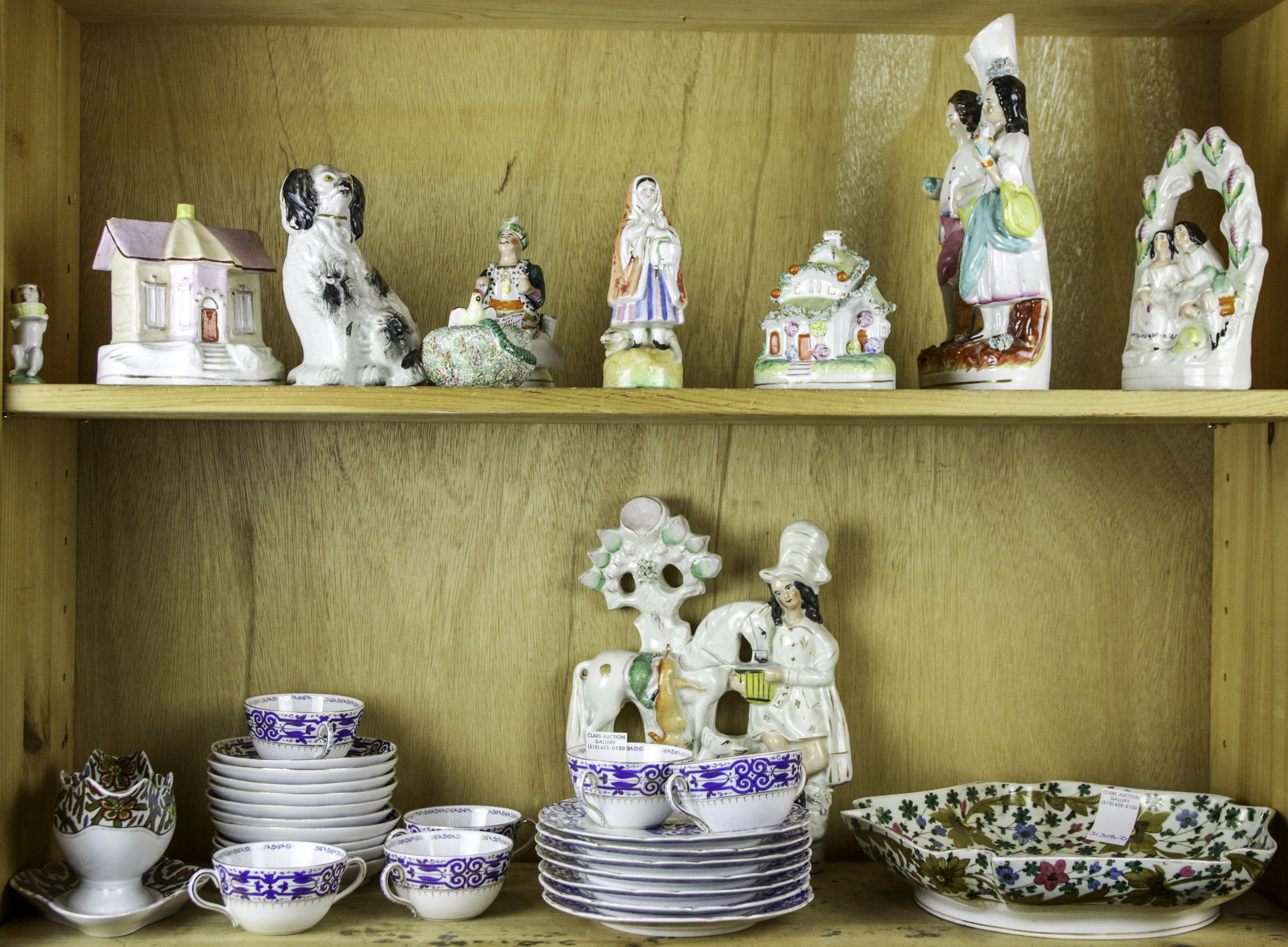 TWO SHELVES OF PORCELAIN FIGURINES 3a661c