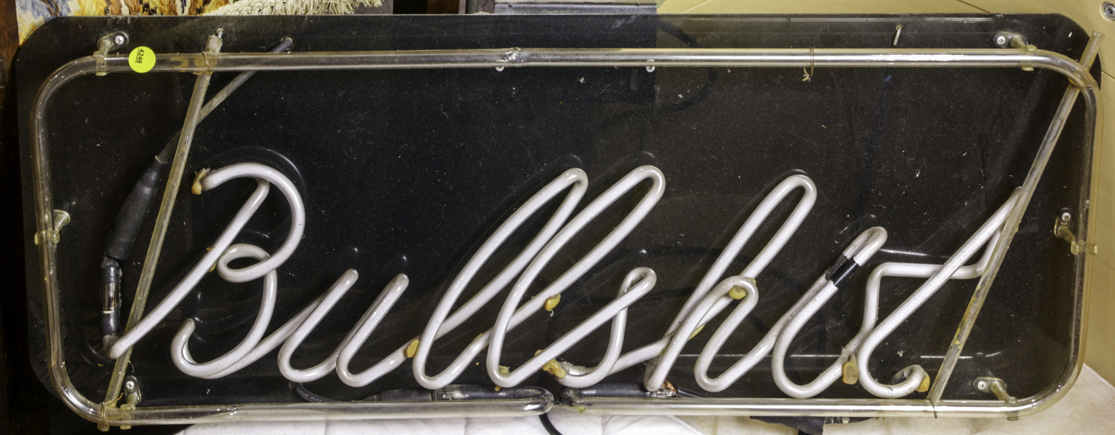 A VINTAGE NEON SIGN READING "BULLSHIT,