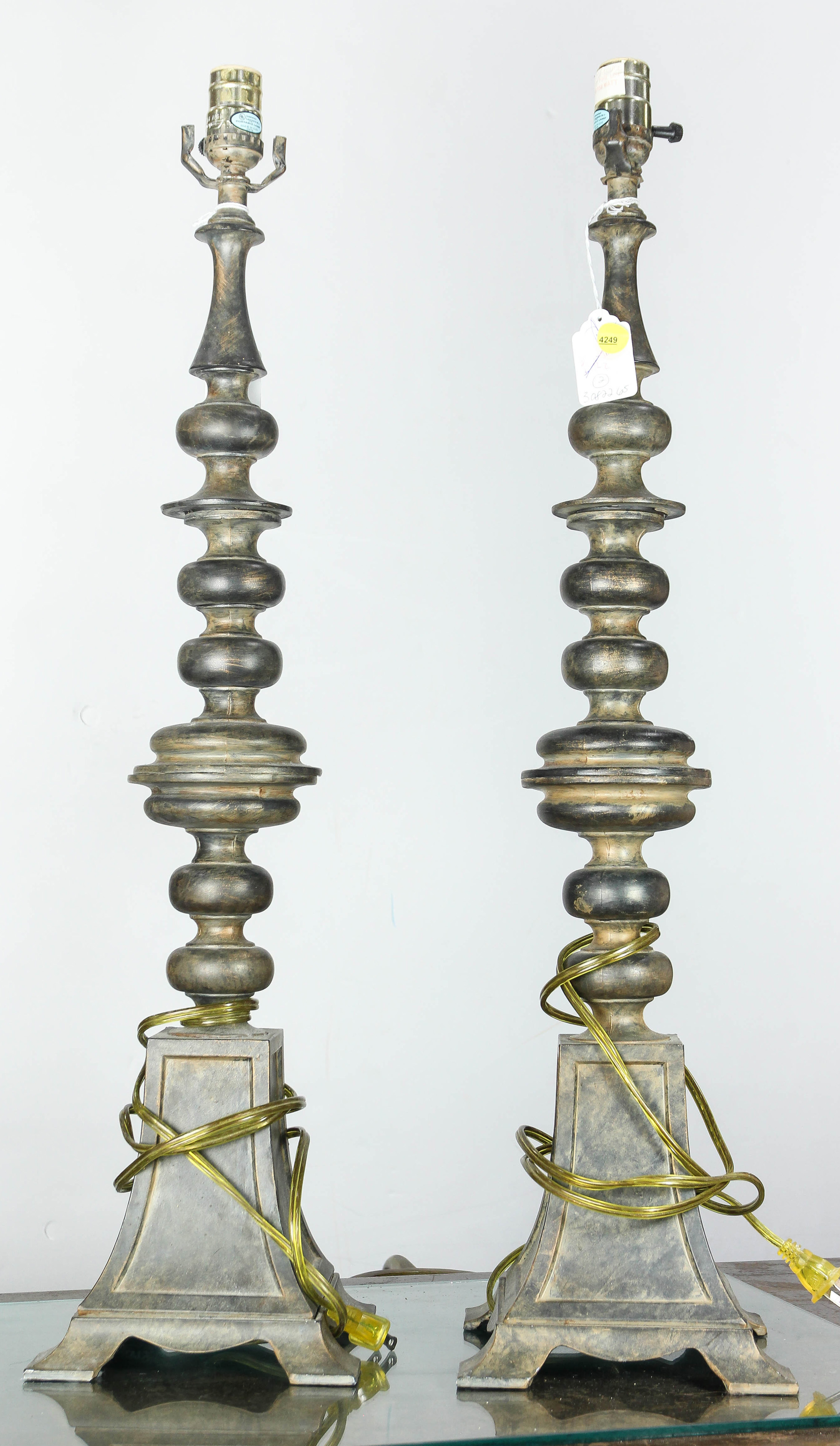 A PAIR OF TALL BAROQUE STYLE PATINATED