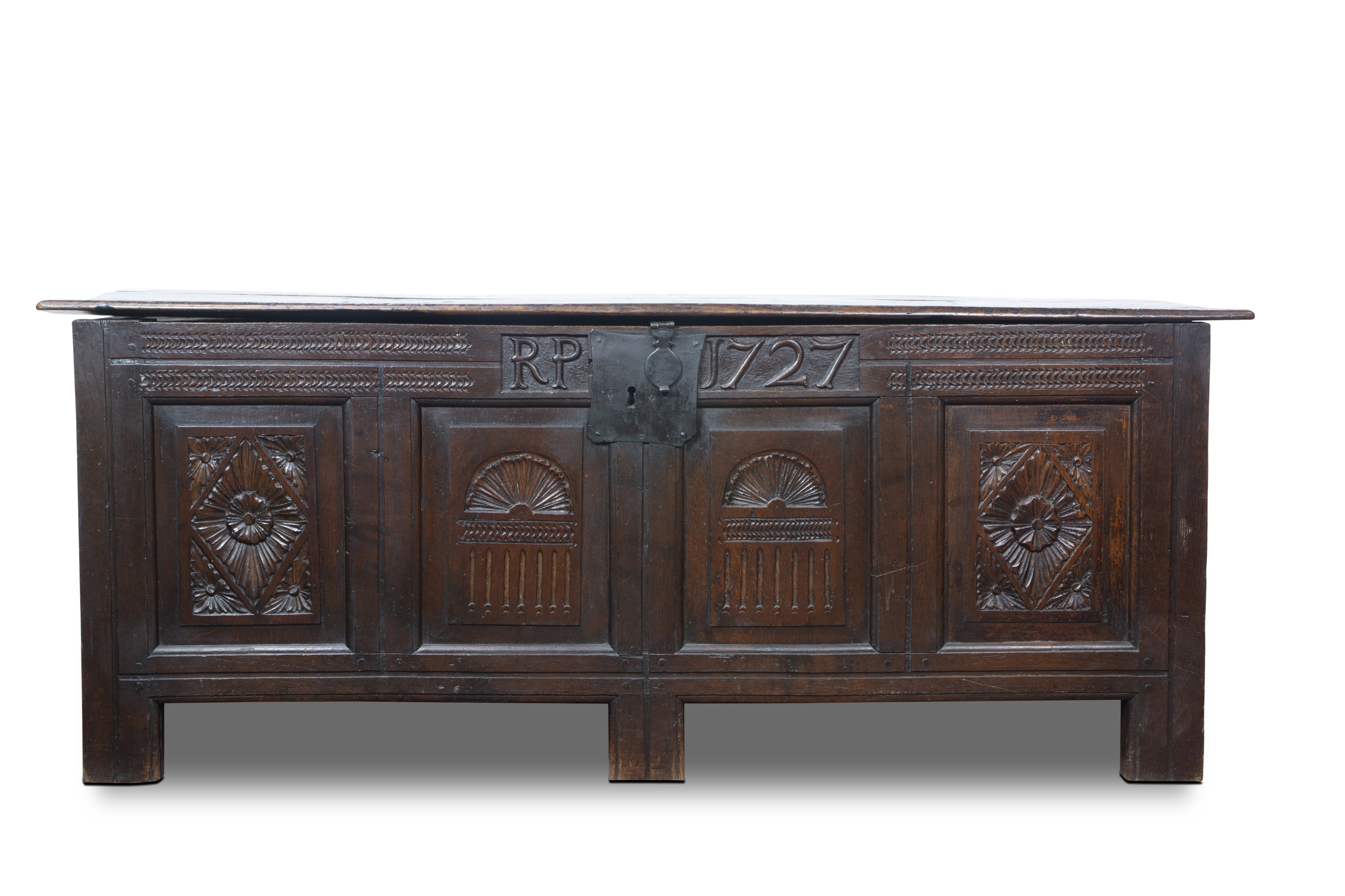 A GEORGIAN CARVED CHEST DATED 1727,