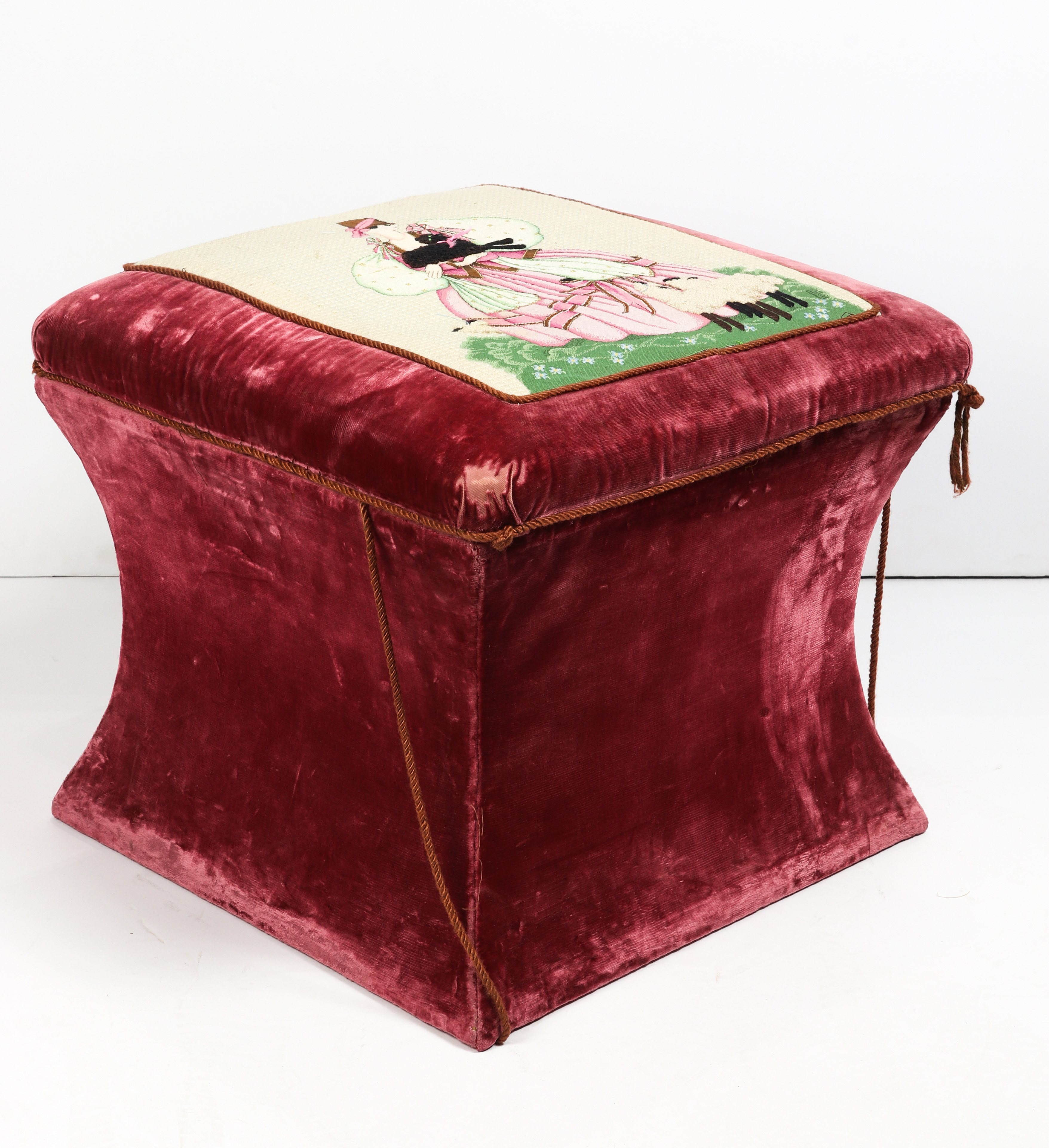 A VICTORIAN OTTOMAN UPHOLSTERED