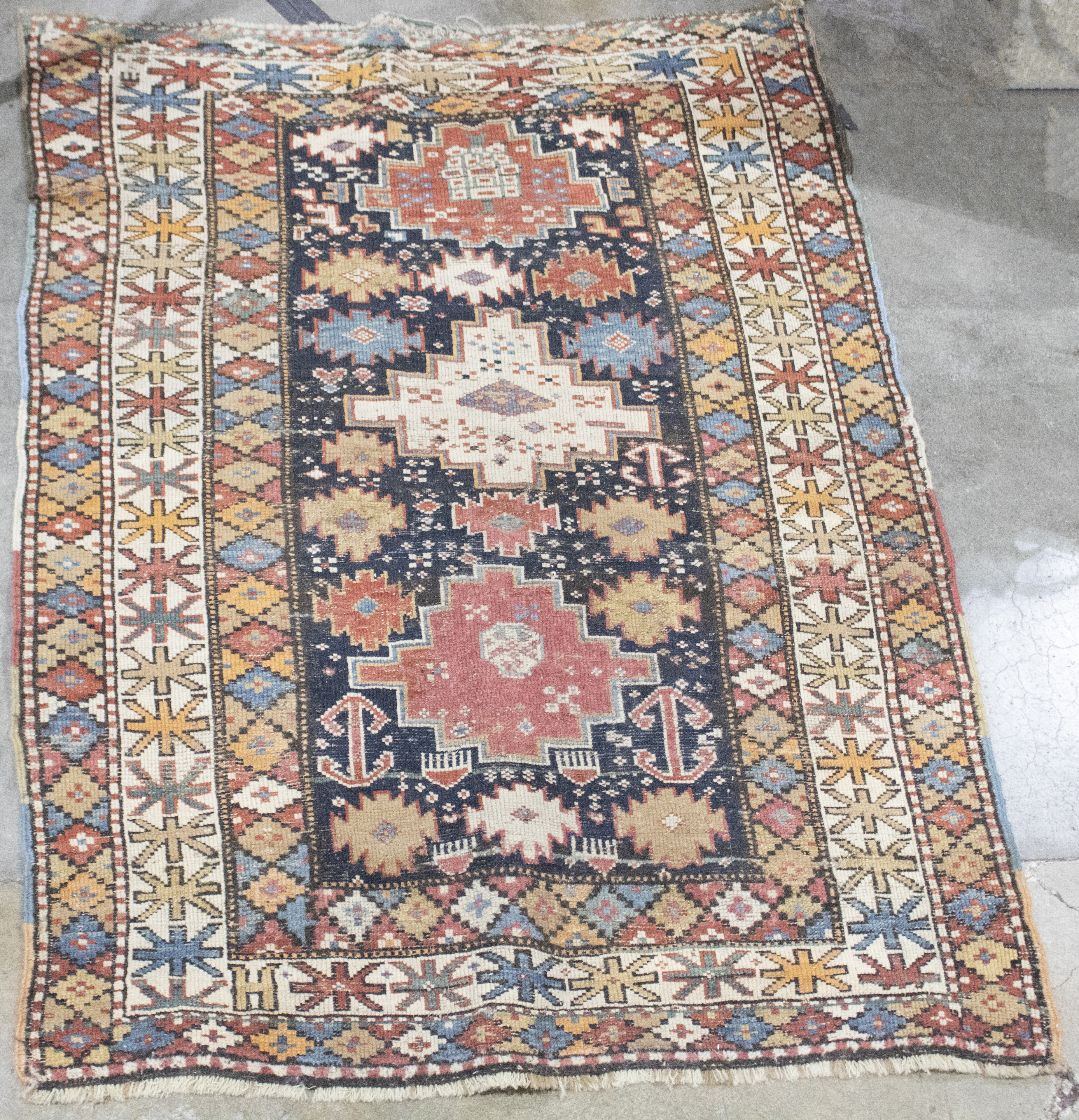 A CAUCASIAN CARPET A Caucasian carpet,