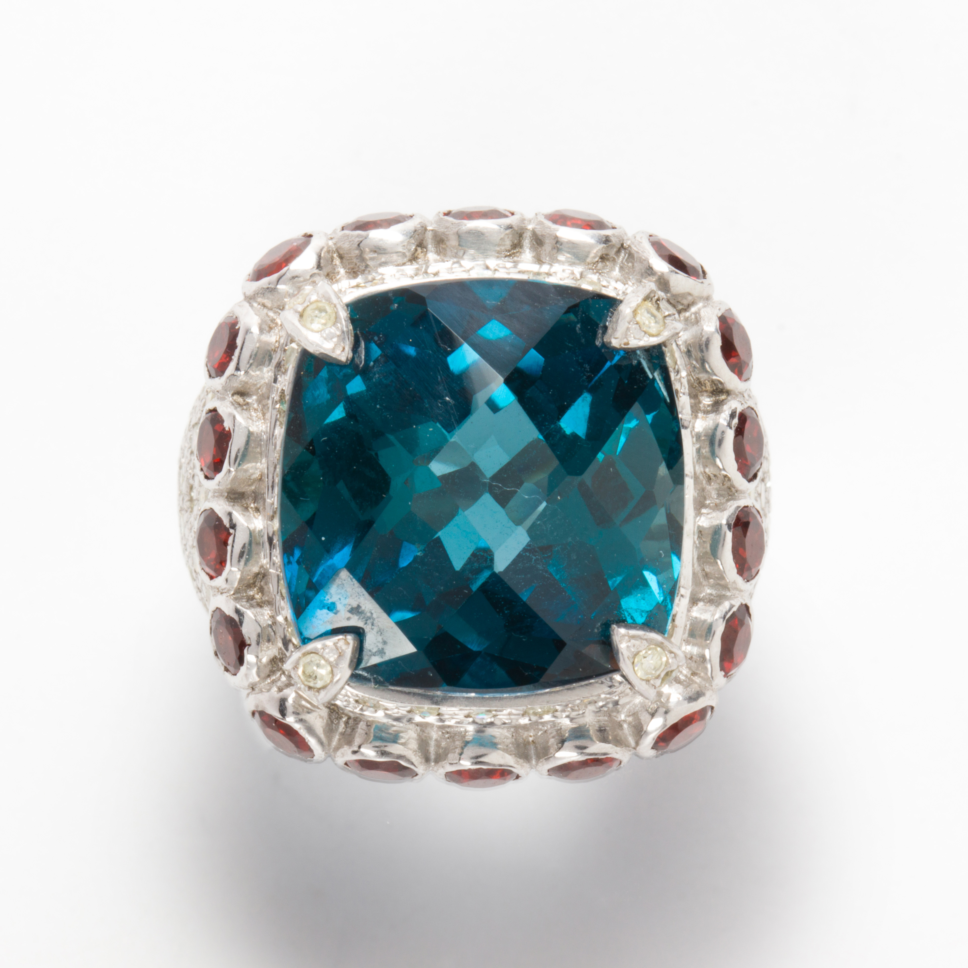 A BLUE TOPAZ, GARNET AND DIAMOND