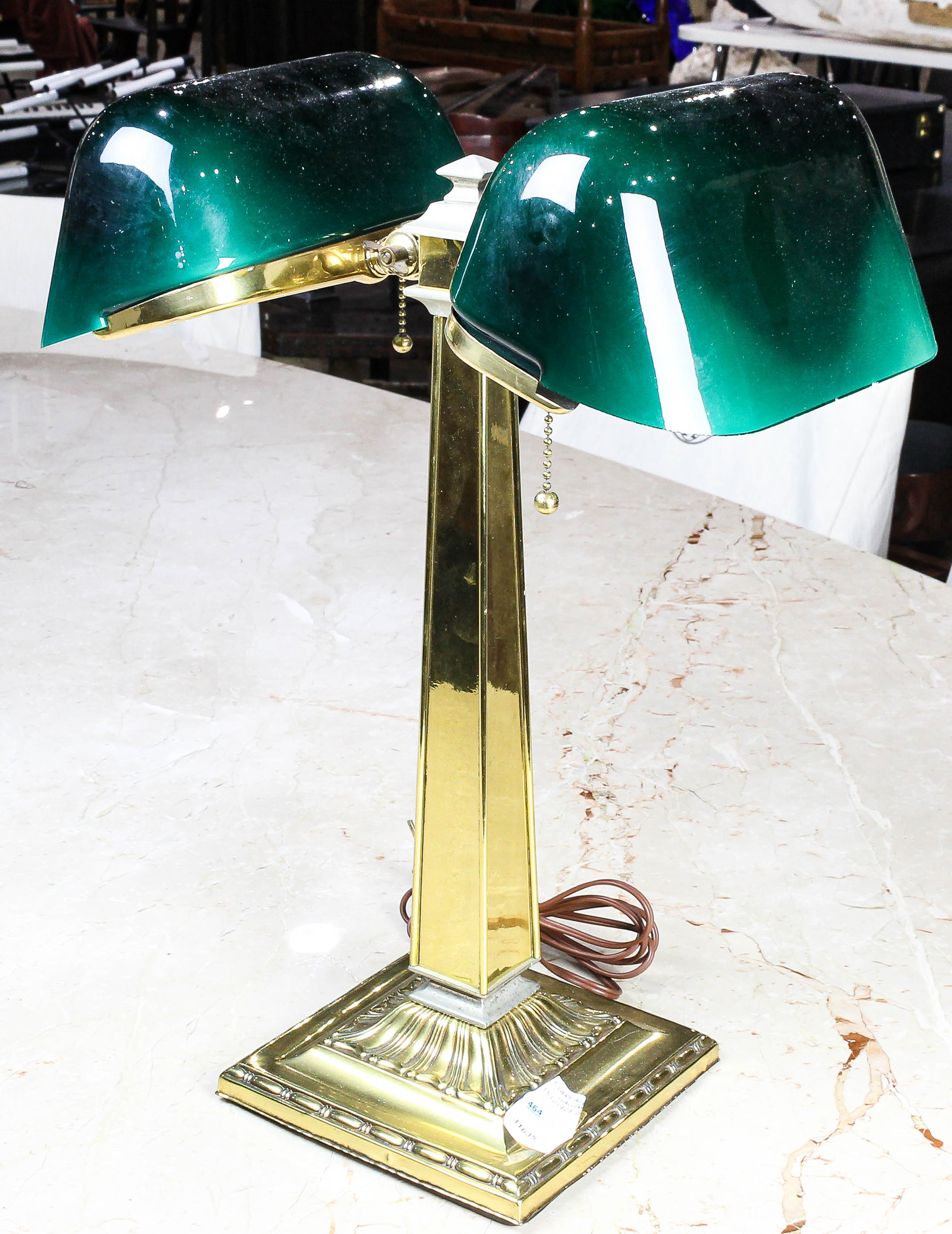 A BRASS AND GREEN GLASS ADJUSTABLE