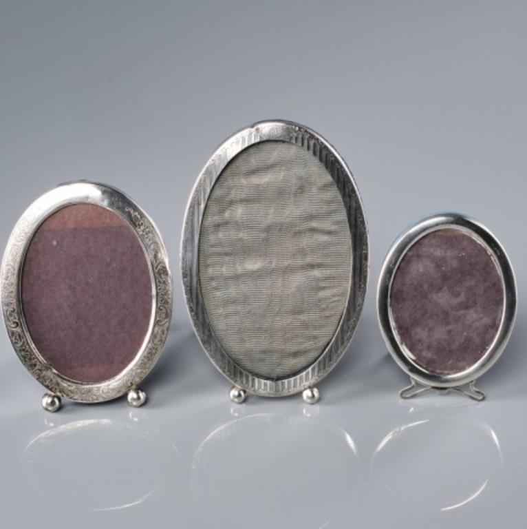 THREE OVAL STERLING PHOTO FRAMESThree