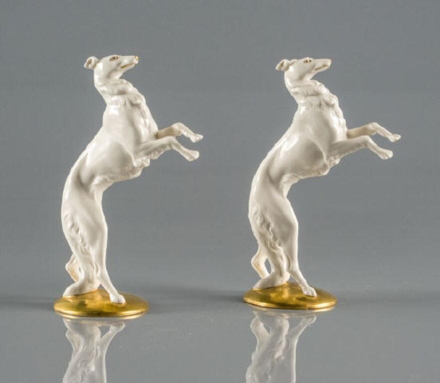 PAIR OF GLAZED PORCELAIN DOG FIGURINESA