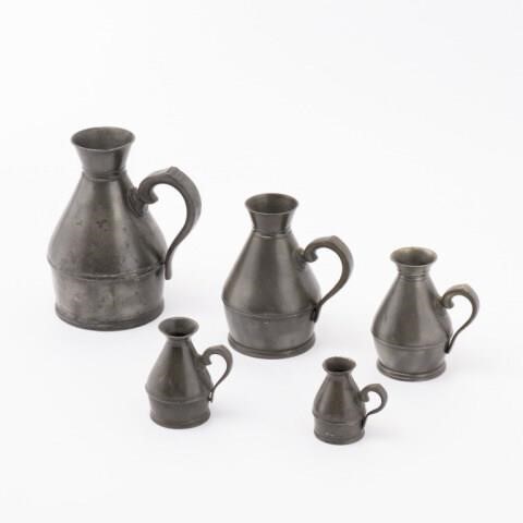 FIVE PEWTER GRADUATED MEASURES,