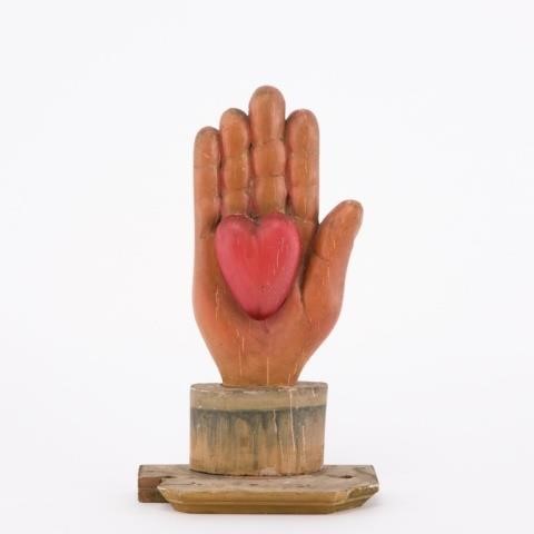 HEART IN HAND CARVING FROM ODD