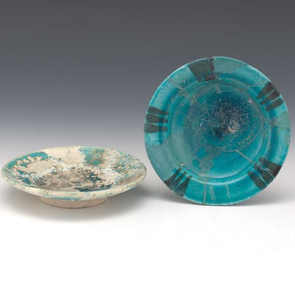 TWO KASHAN FOOTED PLATES. CA. 13TH