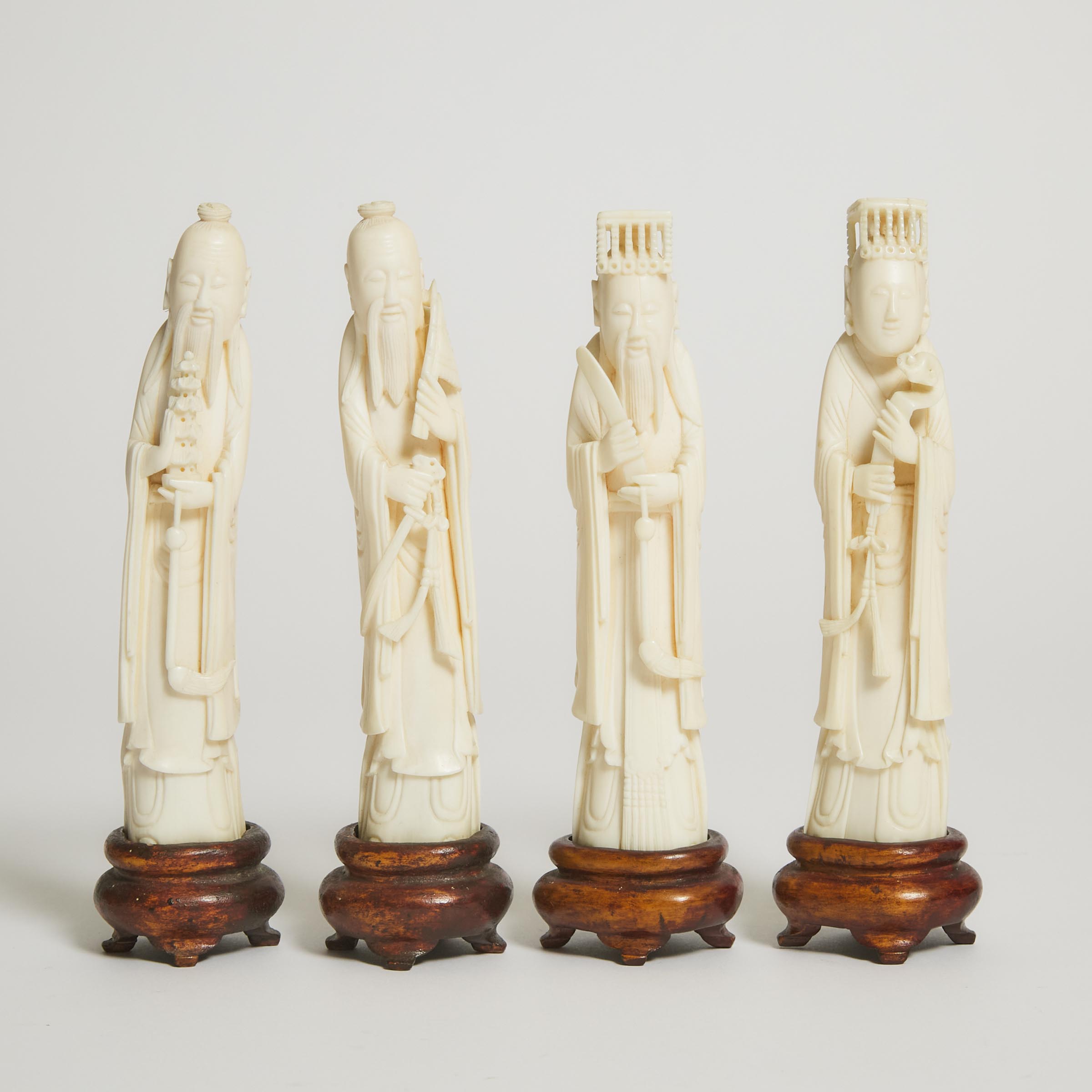A Group of Four Ivory Figures of