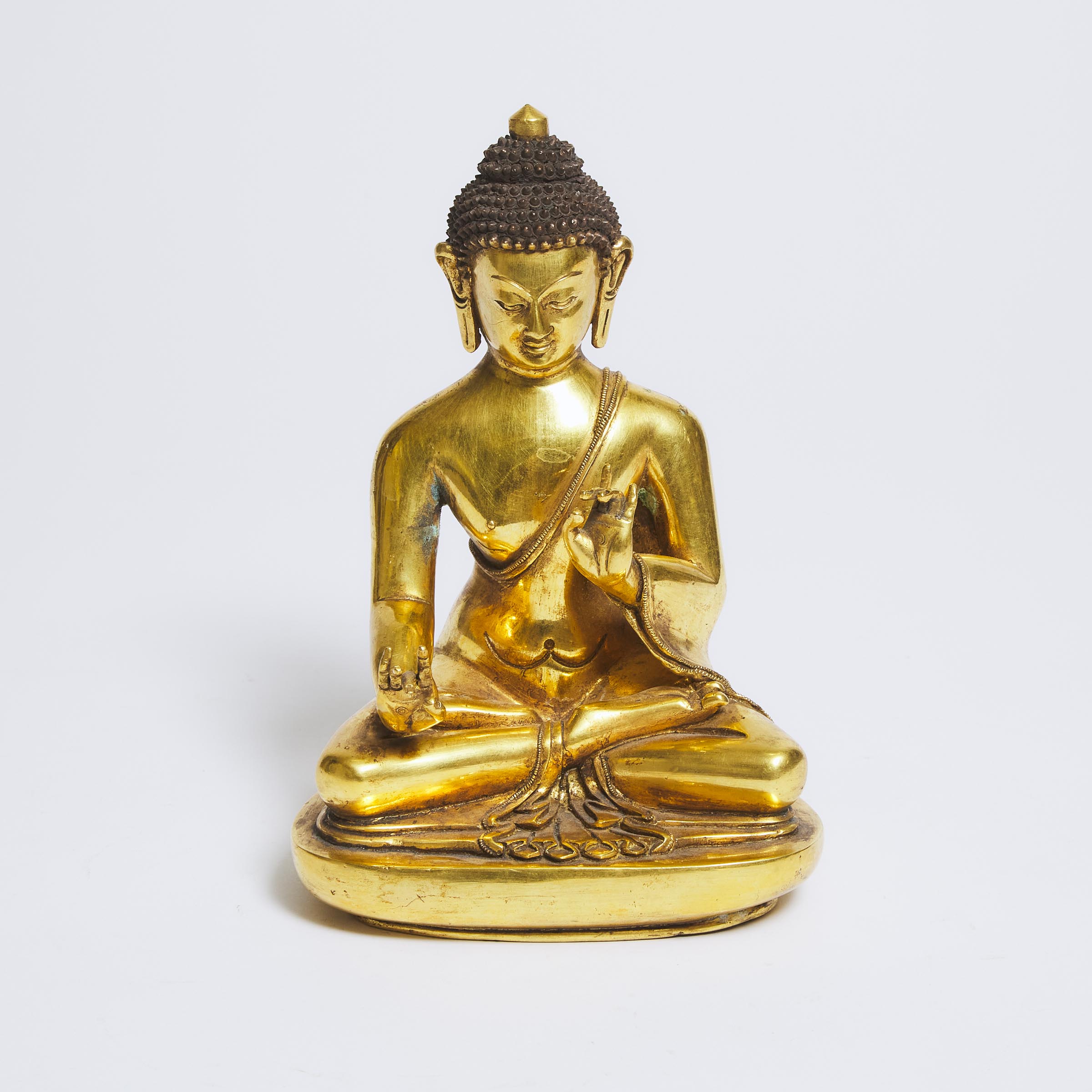 A Gilt Bronze Figure of Shakyamuni,