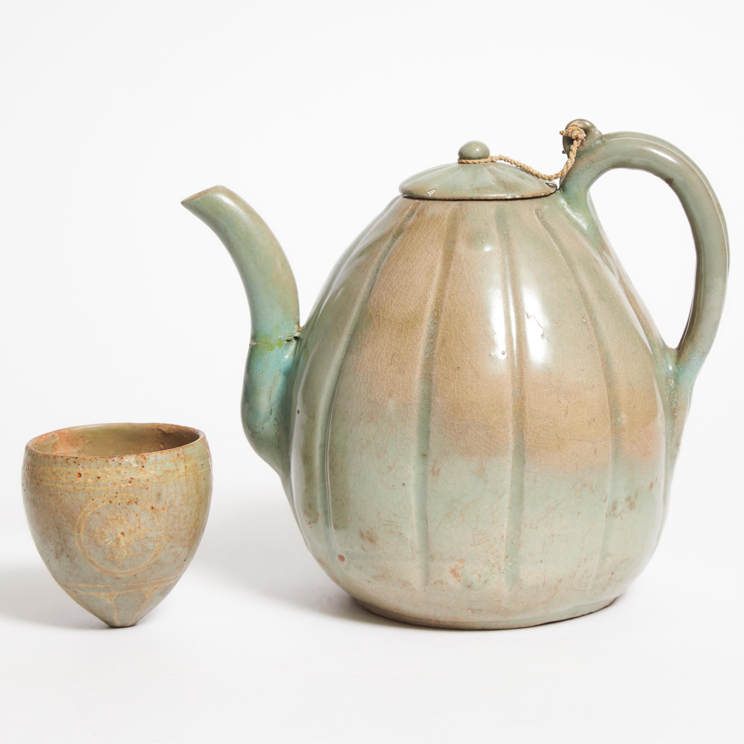 A Celadon-Glazed Melon-Shaped Ewer,