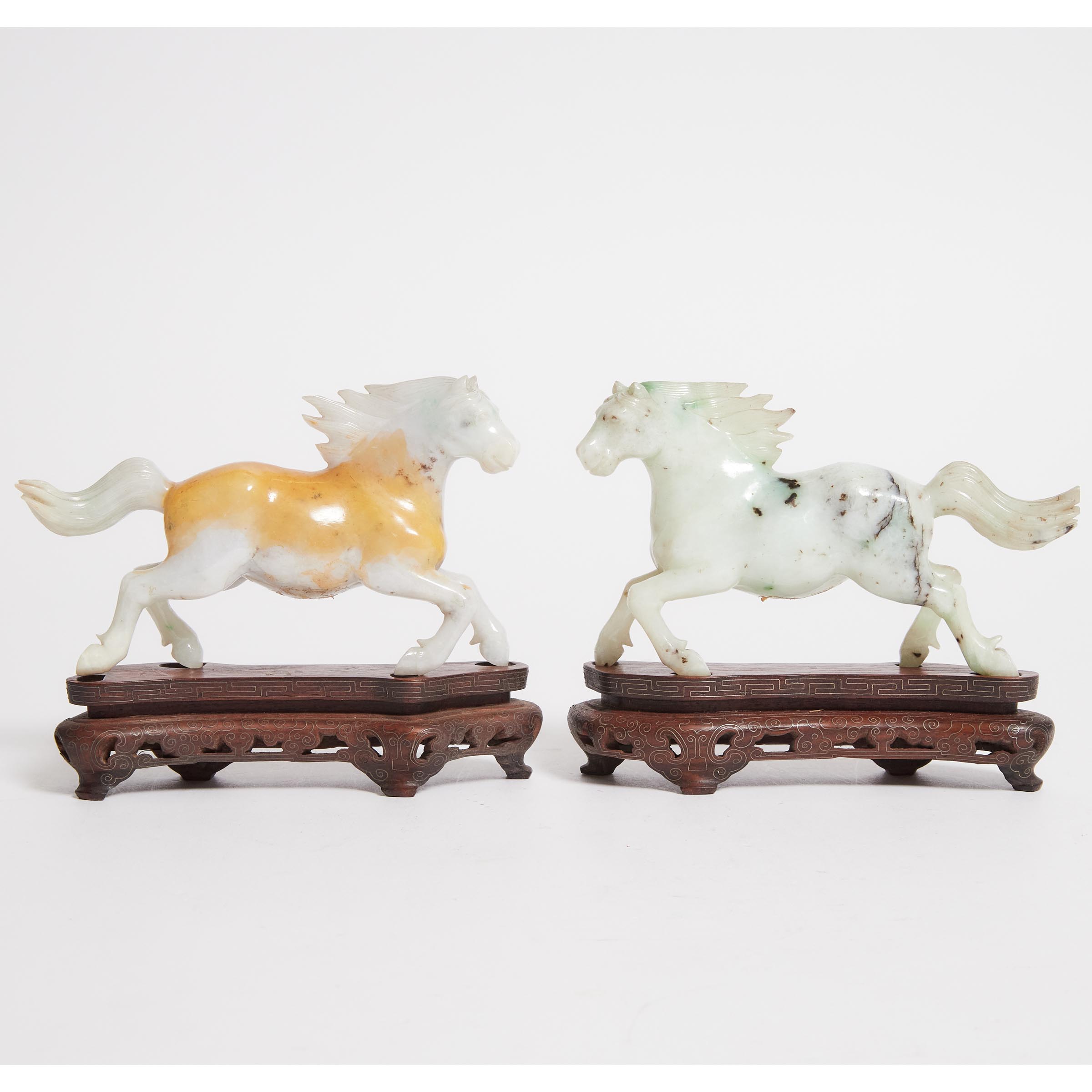 A Pair of Jade Figures of Horses,