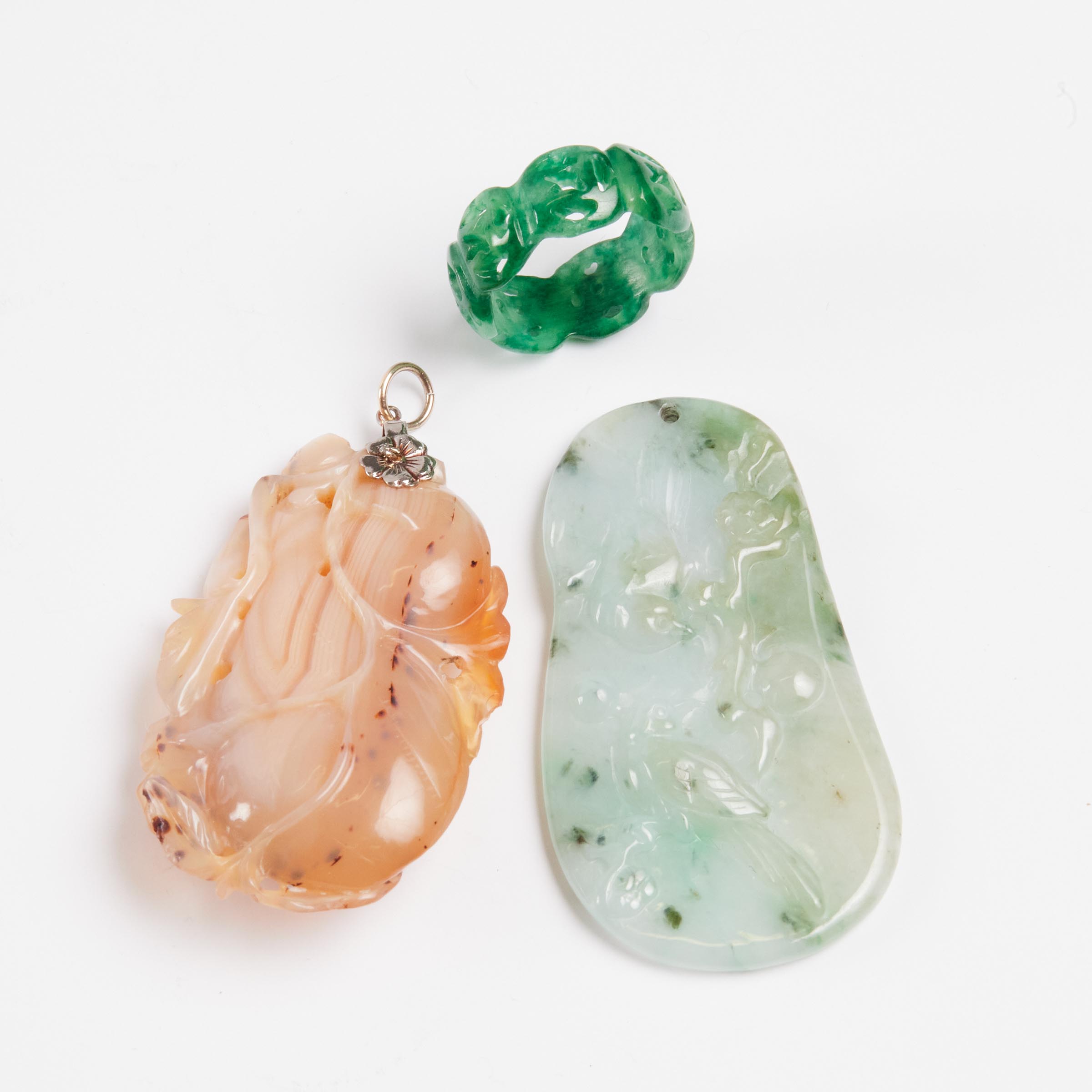 A Carved Agate Pendant, Together