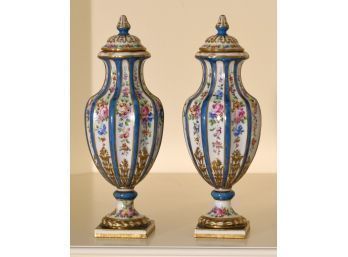 A pair of French Sevres urns, with