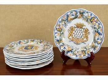 Nine Quimper plates, all with blue