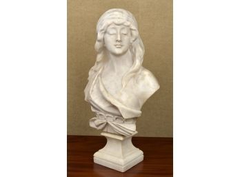 A vintage carved marble bust, illegibly