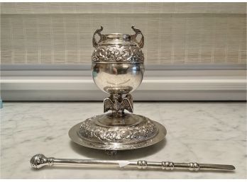 A sterling silver urn handled bowl