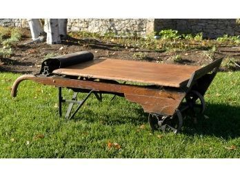 An antique wood and iron hand cart/industrial