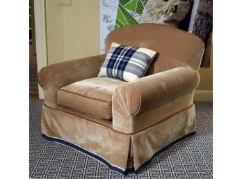 A custom made swiveling club chair with