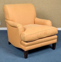 A custom club chair upholstered