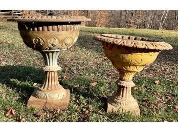 Two antique iron garden urns, a