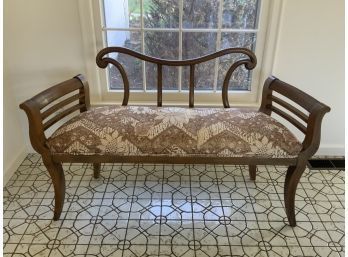 Vintage mahogany settee with a decorative