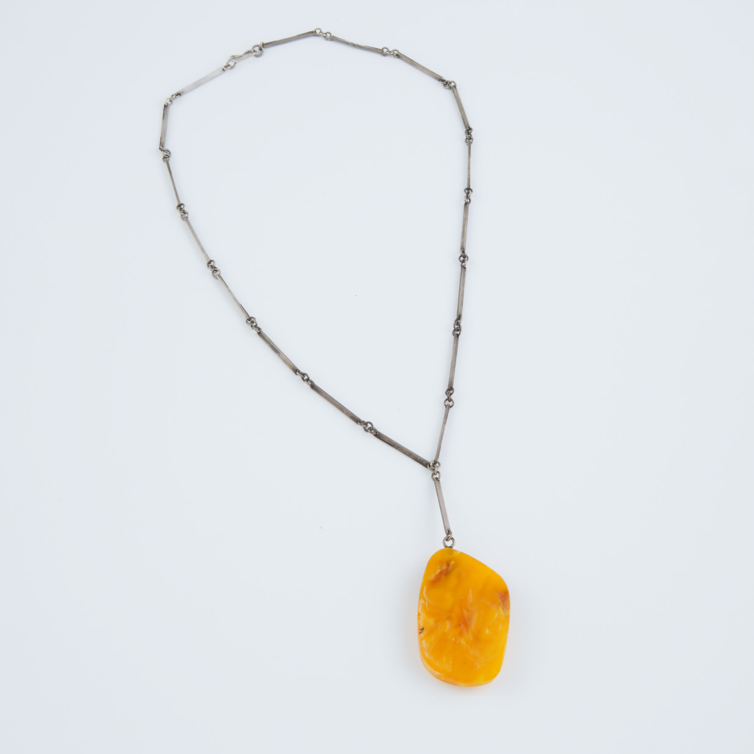Carved Amber Pendant suspended 3ab56e