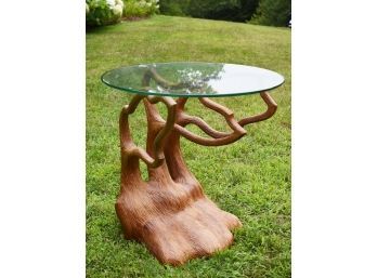 Designer end table with a carved