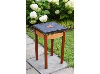 A wood and stone artisan made side table