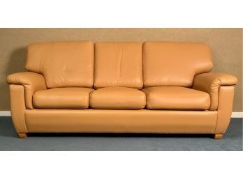 A three cushion modern sofa, in light