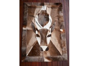 A wall hanging of sewn hides in 3ab628