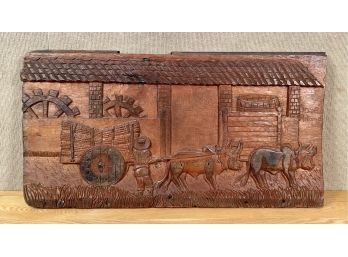 A contemporary relief carved wood