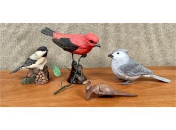Three artisan carved birds and