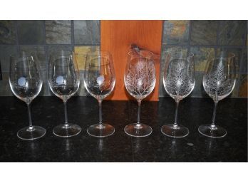 Six wine glasses including three