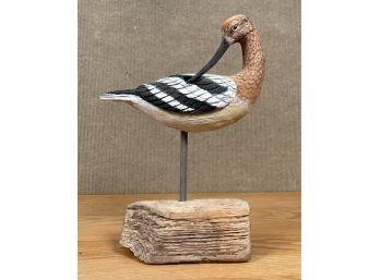 An artisan carved shorebird sculpture