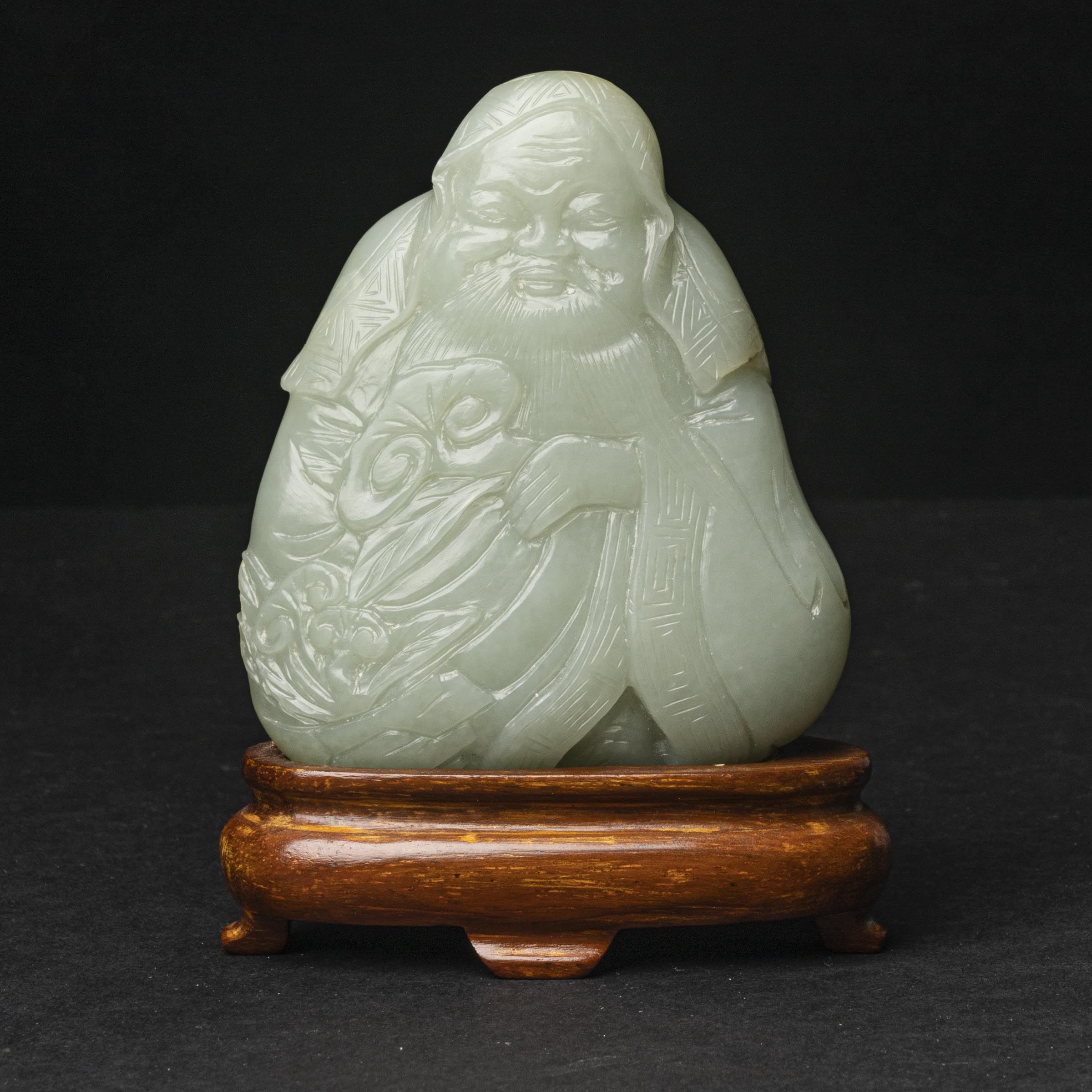 A Pale Celadon Jade Figure of the Daoist