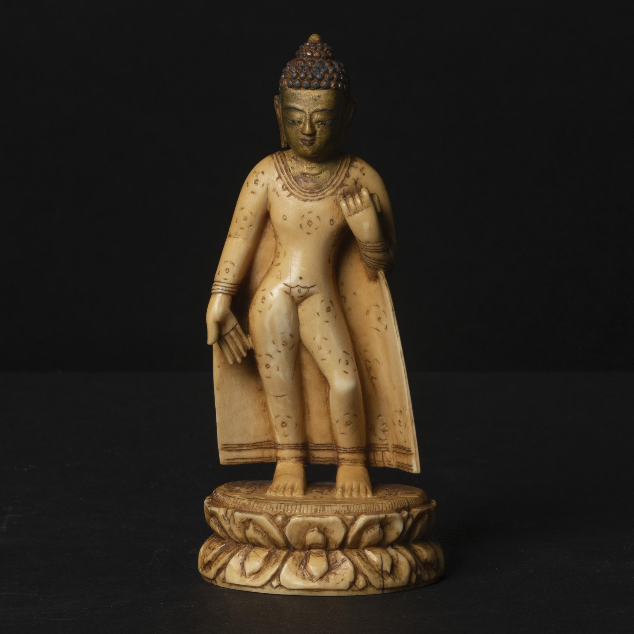 A Gilt Painted Ivory Figure of
