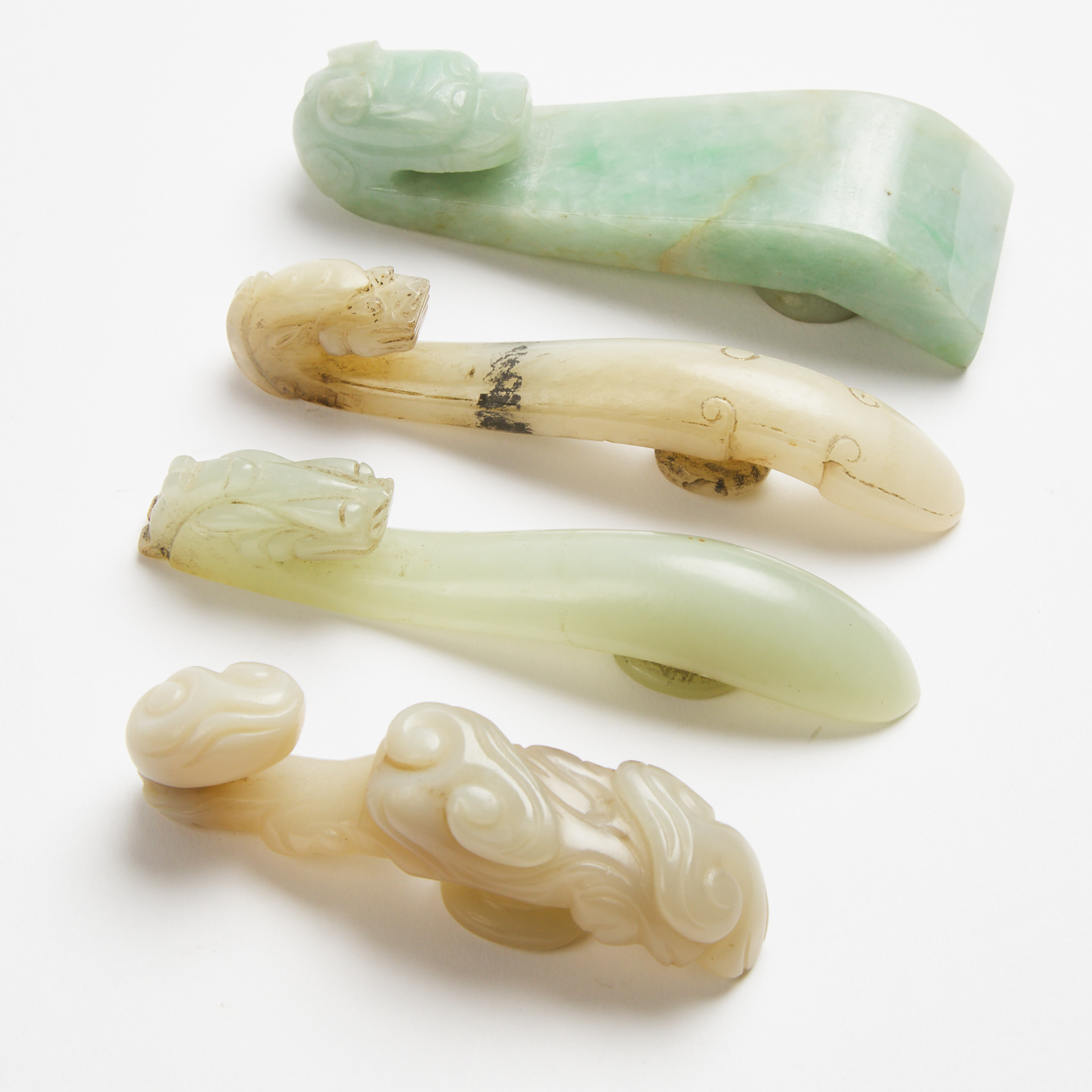 A Group of Four Jade and Jadeite 3ab886