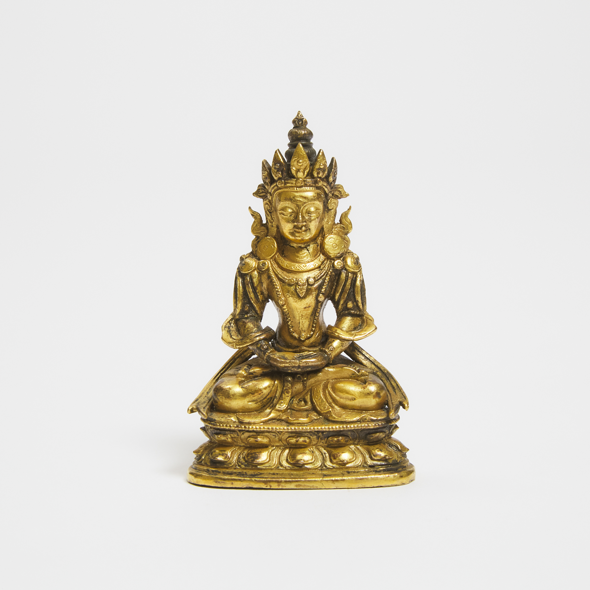 A Small Tibetan Gilt Bronze Seated