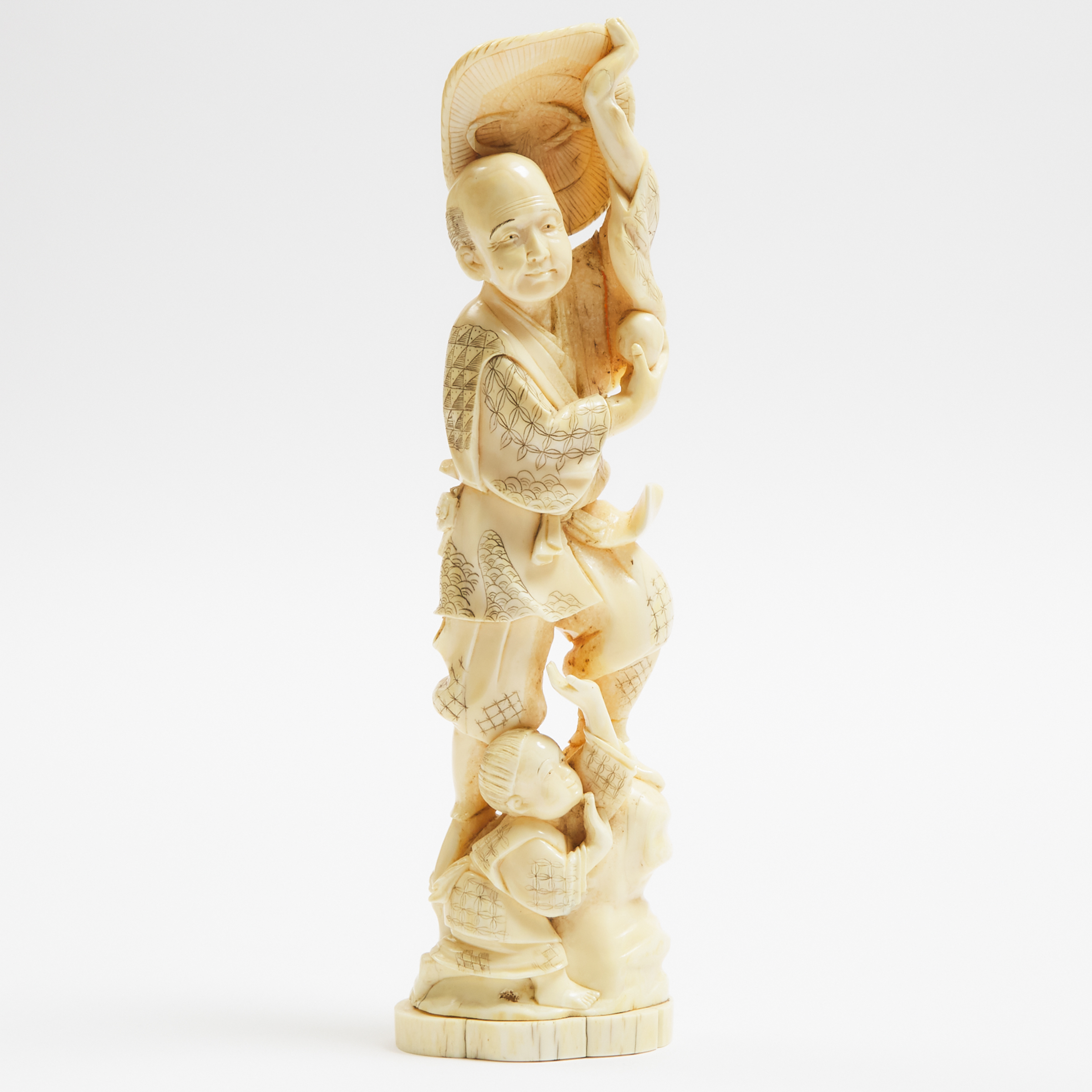 An Ivory Okimono of a Farmer and Child,