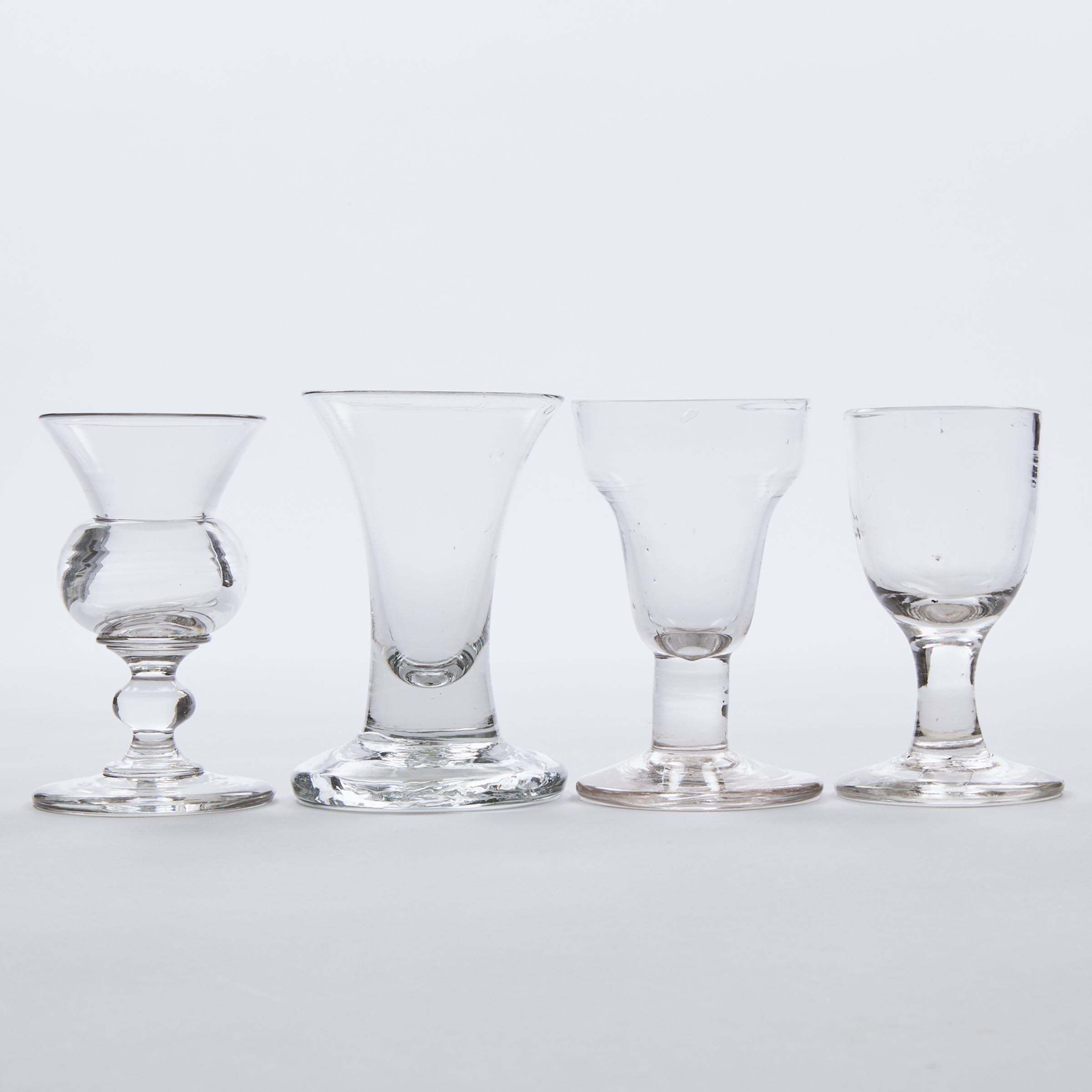 Four English Dram or Firing Glasses,